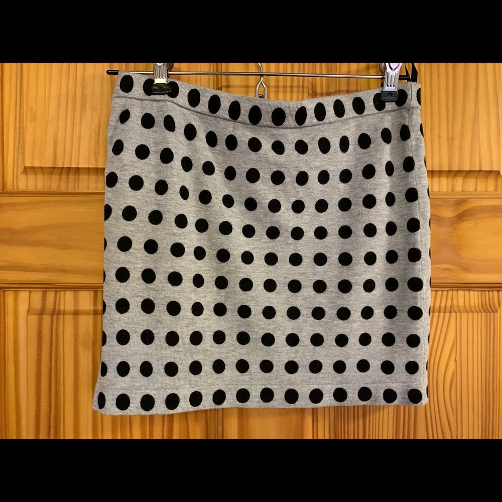 Mini skirts.  1 black, 1 black/gray polka dots.